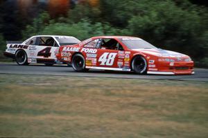 Joe Nott's Ford Thunderbird gets inside Dave Sensiba's Chevy Lumina at turn 3