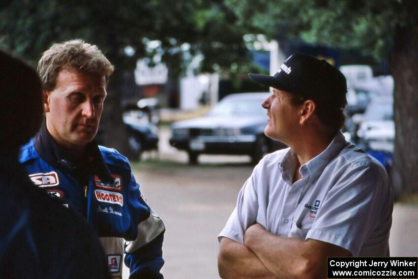 Scott Hansen (L) and Mike Eddy (R) converse