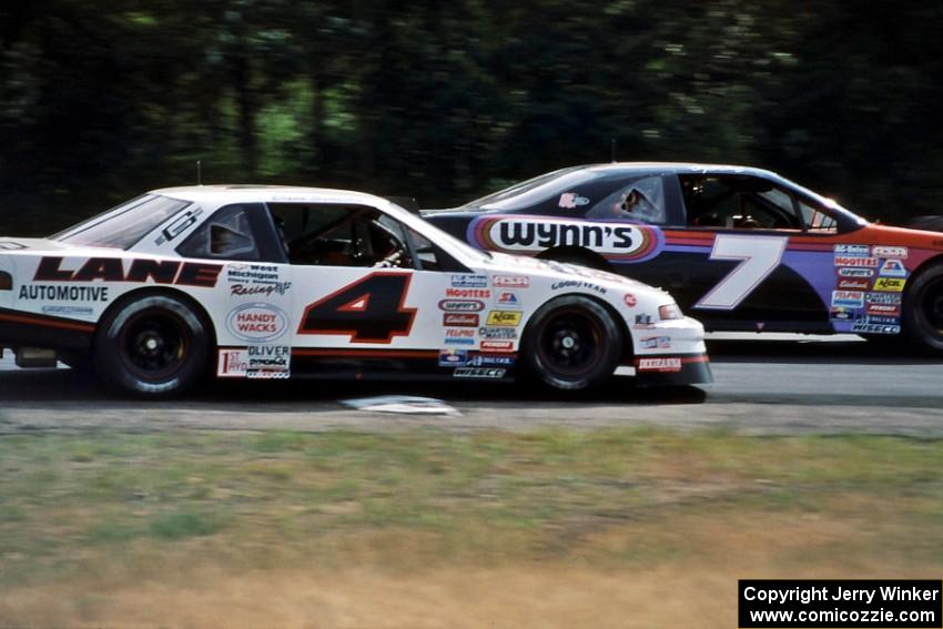 Gary St. Amant's Ford Thunderbird keeps ahead of Dave Sensiba's Chevy Lumina out of turn 3.