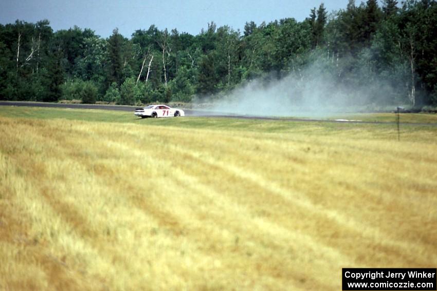 A.J. Cooper's Ford Thunderbird spins coming out of turn 2