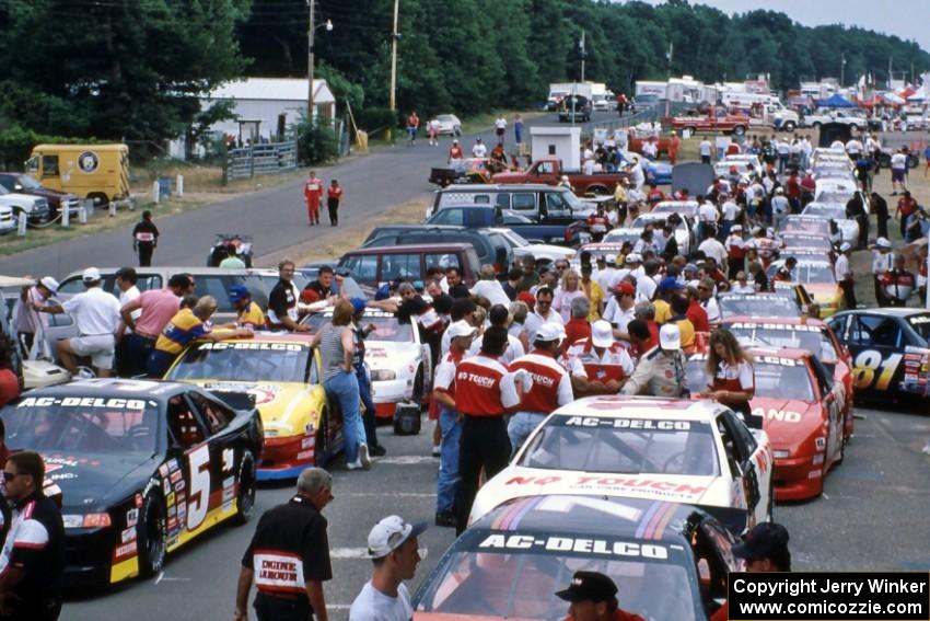 The field lines up on the false grid behind the start tower before the start of the race.