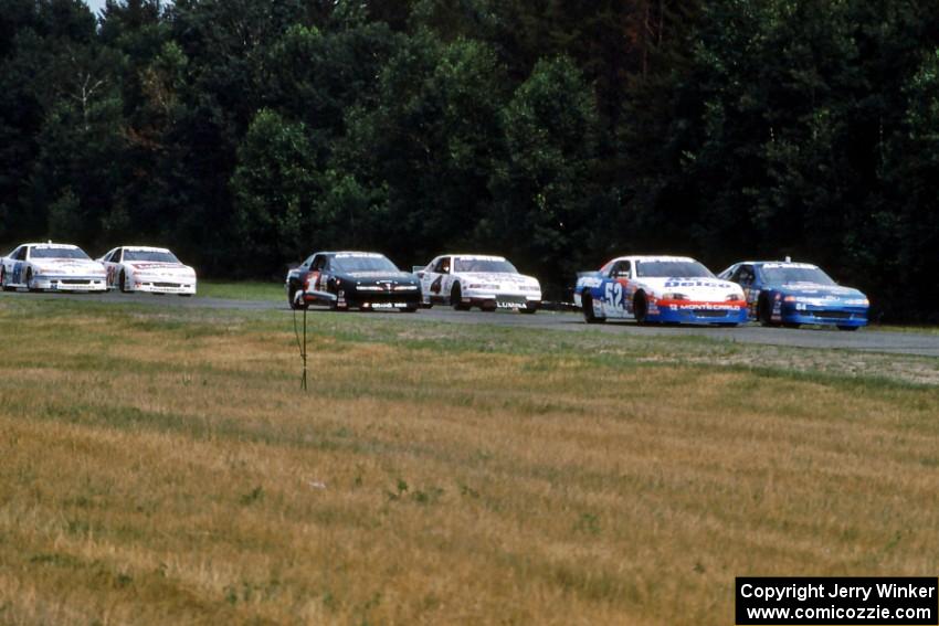 The field comes into turn 3 on the pace lap