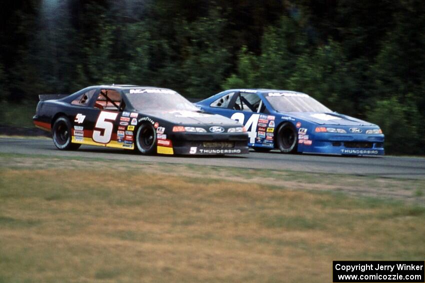 Bryan Reffner's Ford Thunderbird gets the inside line on Lou Gigliotti's Ford Thunderbird coming into turn 3