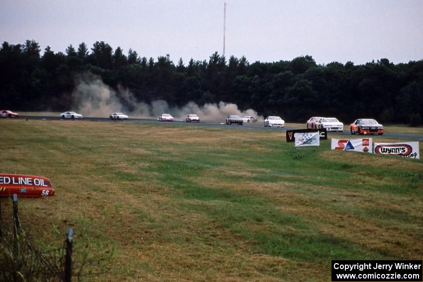 Rick Miller's Chevy Monte Carlo goes into the grass at turn 3