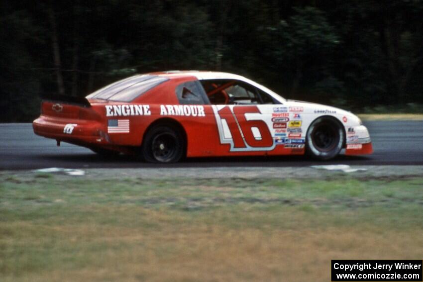 John Freeman's Chevy Monte Carlo limps through turn 3 with a flat tire