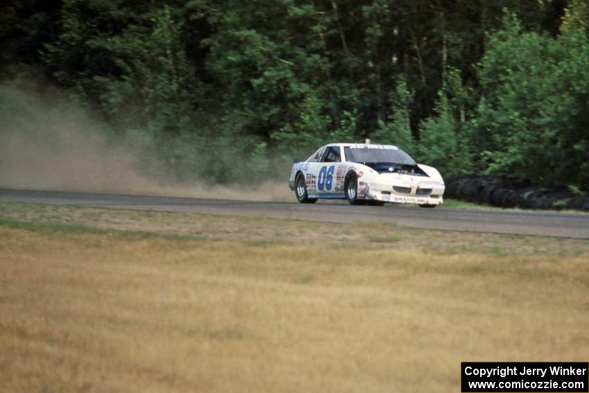 Leighton Reese's Pontiac Grand Prix uses all of the track coming out of turn 2