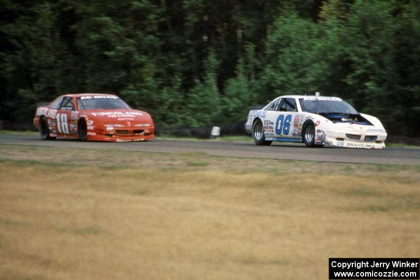 Leighton Reese's Pontiac Grand Prix ahead of Mike Miller's Pontiac Grand Prix