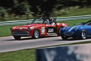 Kurtis-Kraft 500M passing an Austin-Healey Sprite