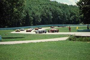 Ford GT-40s through the carousel on the pace lap