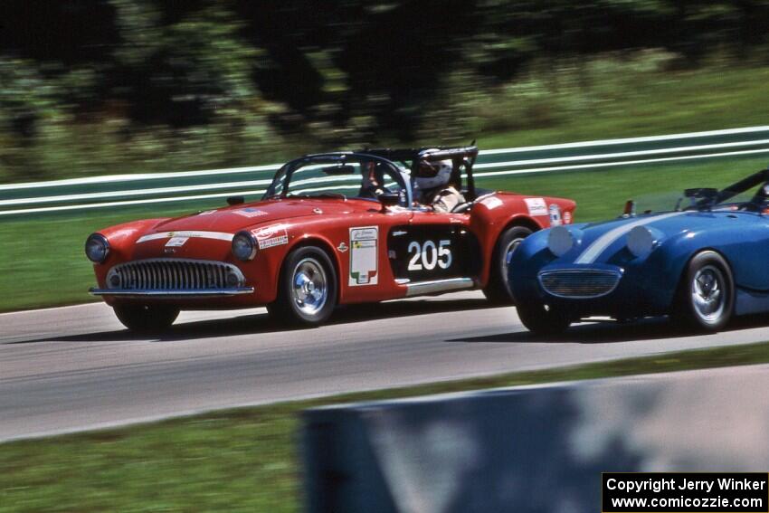 Kurtis-Kraft 500M passing an Austin-Healey Sprite