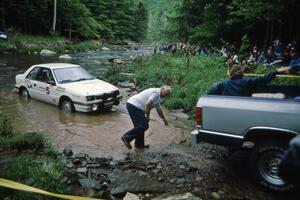 Henry Krolikowski / Cindy Krolikowski Dodge Shadow gets pulled from the finish of SS1, Stony Crossing.