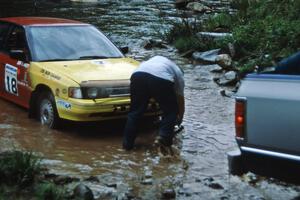 Dean Fry / Don Kennedy Subaru Legacy gets pulled from the creek on SS1, Stony Crossing.