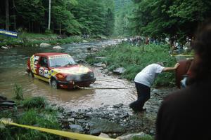 Pete Pollard / Peter Watt VW GTI are pulled from the creek after hydrolocking the engine on SS1, Stony Crossing.