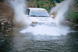 Keith Kreisler / Chris Erney Mazda 323GTX finishes SS1, Stony Crossing.