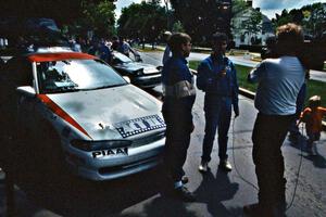 Steve Gingras is interviewed at midday service in front of the Mitsubishi Eclipse he and Bill Westrick shared