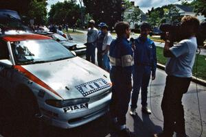 Steve Gingras is interviewed at midday service in front of the Mitsubishi Eclipse he and Bill Westrick shared