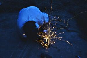 Chris Havas at work on his VW Golf suspension at Germania service