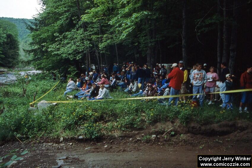 The crowd awaits the start of the creek crossing at the finish of SS1.