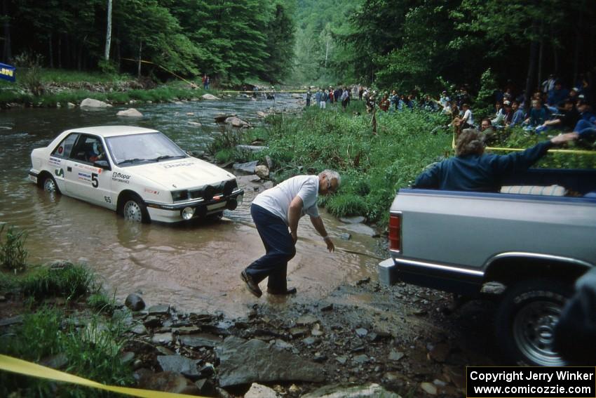 Henry Krolikowski / Cindy Krolikowski Dodge Shadow gets pulled from the finish of SS1, Stony Crossing.