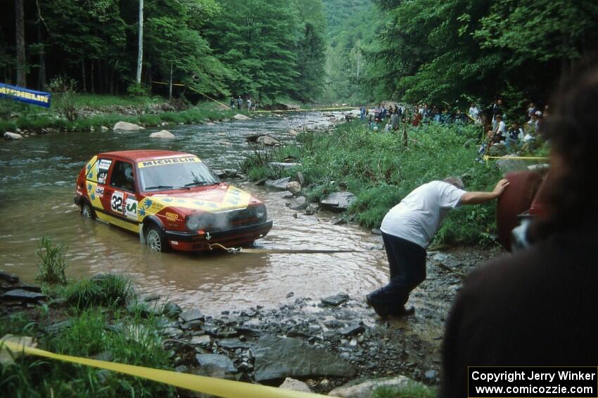 Pete Pollard / Peter Watt VW GTI are pulled from the creek after hydrolocking the engine on SS1, Stony Crossing.