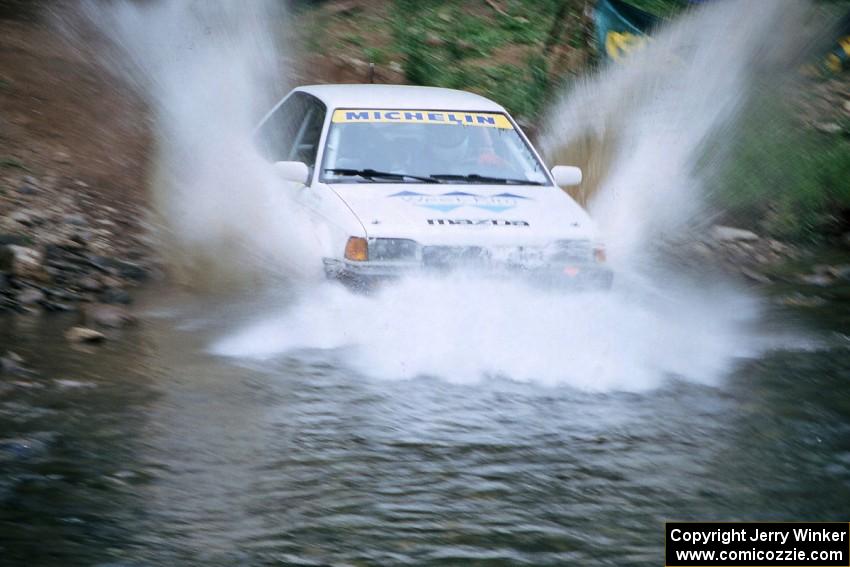 Keith Kreisler / Chris Erney Mazda 323GTX finishes SS1, Stony Crossing.