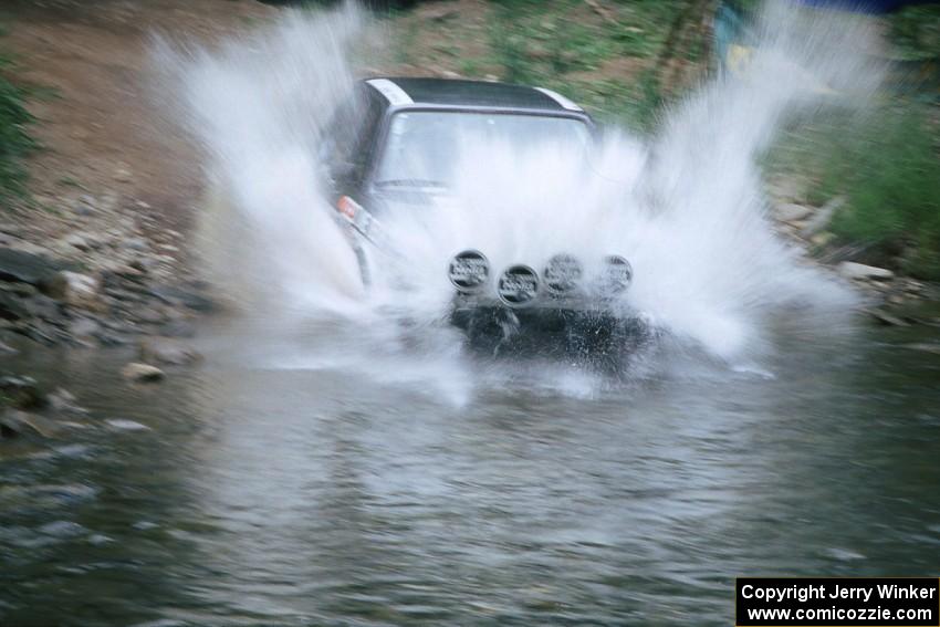 Eric Schroeder / Jennie Mynhier VW Jetta GLI finishes SS1, Stony Crossing.