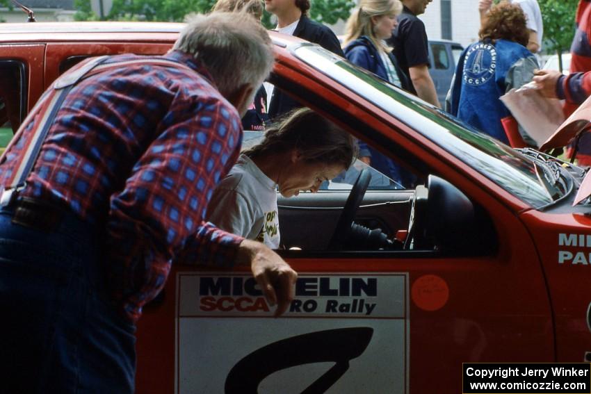 Paula Gibeault goes over notes in the Mike Whitman Ford Sierra Cosworth