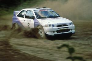 Carl Merrill / Lance Smith Ford Escort Cosworth RS at the spectator point on SS1, Kabekona.