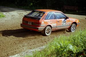 Gail Truess / Pam McGarvey Mazda 323GTX on SS13, Wolf Lake.