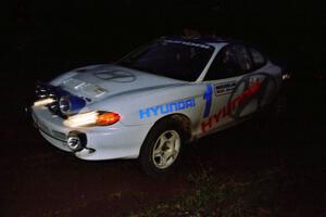 Paul Choinere / Jeff Becker Hyundai Tiburon on a night stage.