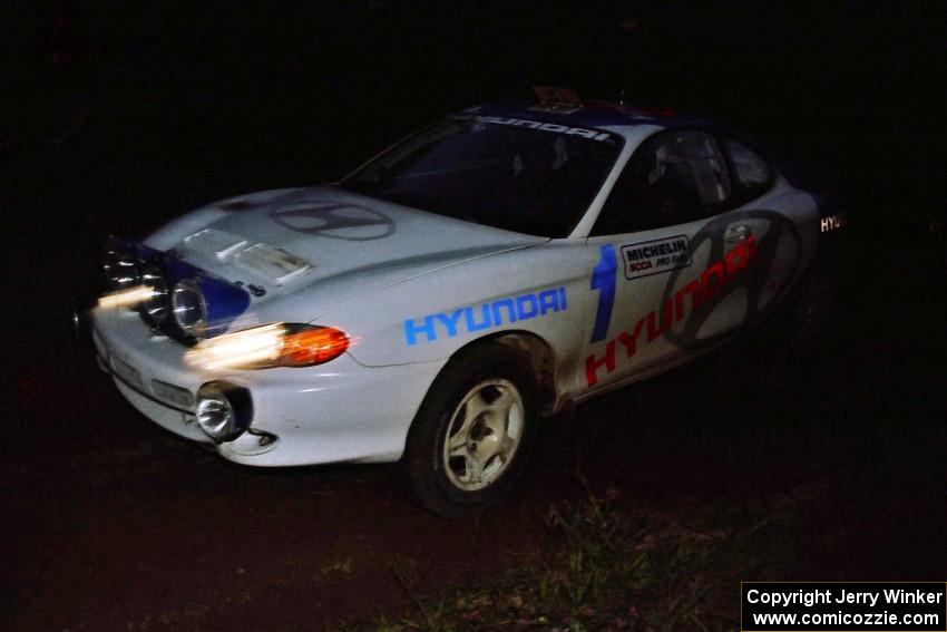 Paul Choinere / Jeff Becker Hyundai Tiburon on a night stage.