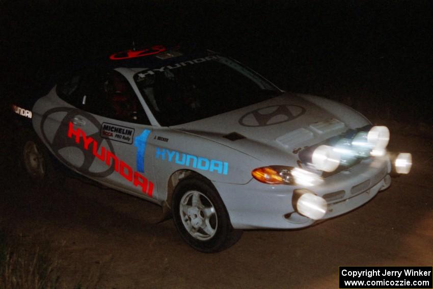 Paul Choinere / Jeff Becker Hyundai Tiburon on a night stage.