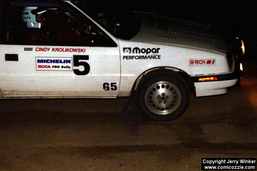 Henry Krolikowski / Cindy Krolikowski Dodge Shadow on a night stage.