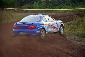 Paul Choiniere / Tom Grimshaw drift their Hyundai Tiburon hard at a right turn on the practice stage.