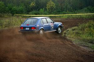 Mark Utecht / Paul Schwerin drift their Dodge Omni GLH-Turbo hard at a right turn on the practice stage.
