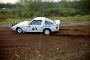 Ted Grzelak / Dan Gildersleeve drift their Mazda RX-7 through a right hander on the practice stage.