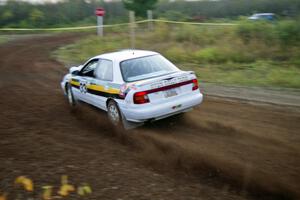 Tom Ottey / Pam McGarvey drift their Hyundai Elantra through a hard right on the practice stage.