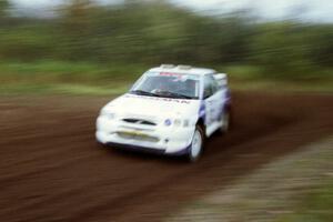 Carl Merrill / Lance Smith at speed on the practice stage in their Ford Escort Cosworth RS.