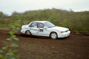 Bill Driegert / Hishin Shim at speed in their Mitsubishi Galant VR-4 on the practice stage.