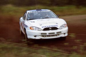 Paul Choiniere / Tom Grimshaw drift by in their Hyundai Tiburon on the practice stage.