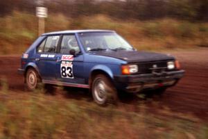 Mark Utecht / Paul Schwerin take a tight right-hander in their Dodge Omni GLH-Turbo on the practice stage.
