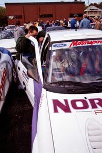 Lance Smith belts into the Ford Escort Cosworth RS he and Carl Merrill shared.