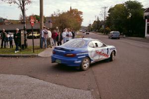 The Paul Choiniere / Tom Grimshaw Hyundai Tiburon exits parc expose and starts its transit to SS1.