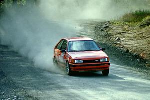 Gail Truess / Nancy Redner at speed in their Mazda 323GTX near the finish of SS2.