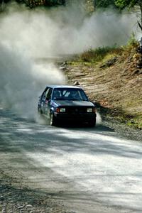 Mark Utecht / Paul Schwerin drift their Dodge Omni GLH-Turbo through one of the final corners of SS2.