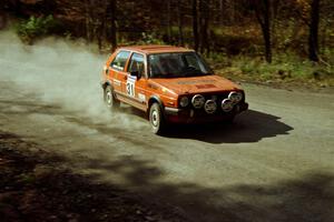 Doug Davenport / Al Kintigh drift their VW GTI through the final corner of SS2.