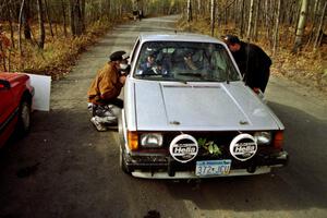 Brett Corneliusen / Brenda Corneliusen bring their VW GTI into the finish of SS2 sporting some leaves in the front grill.