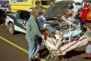 Bryan Pepp takes a breather with his wife at service in L'Anse. Dean Rushford was his co-driver for the event.