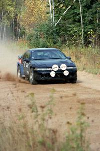 Cal Landau / Eric Marcus accelerate away from the start of Menge Creek I in their Mitsubishi Eclipse GSX.
