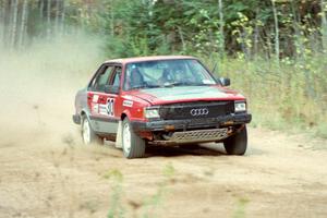 Jon Kemp / Gail McGuire at speed at the start off Menge Creek I in their Audi 4000 Quattro.